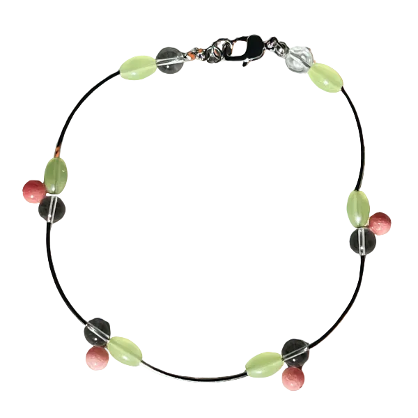 Necklace with colorful beads on an orange background