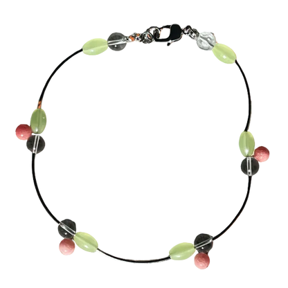 Necklace with colorful beads on an orange background