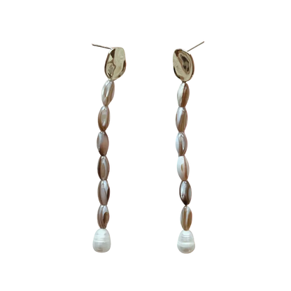 Pair of beaded earrings on an orange gradient background