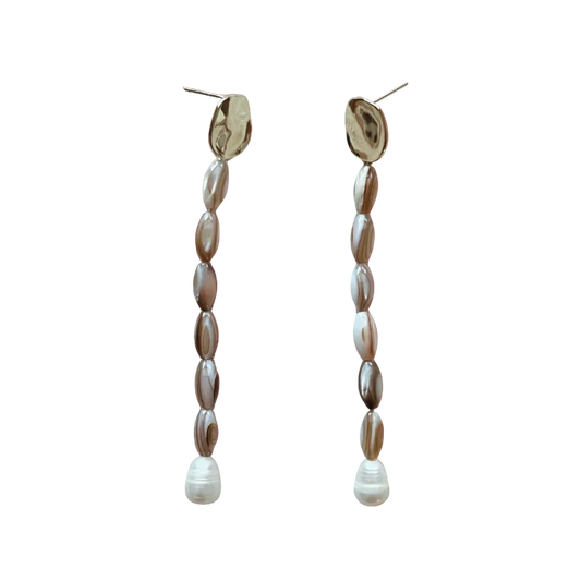 Pair of beaded earrings on an orange gradient background
